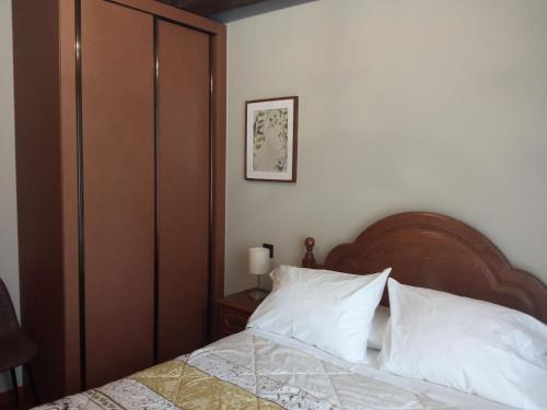 Ένα ή περισσότερα κρεβάτια σε δωμάτιο στο Hotel Arco Navia
