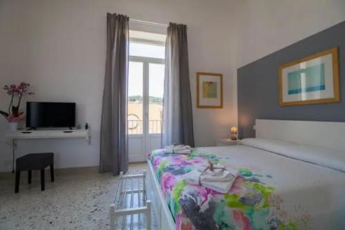 Postel nebo postele na pokoji v ubytování Casa Vacanze Belvedere
