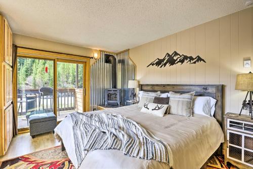 a bedroom with a large bed and a balcony at Keystone Mountain Getaway Walk to Ski Lifts in Keystone