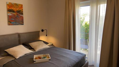 Posteľ alebo postele v izbe v ubytovaní Apartmani Žužić