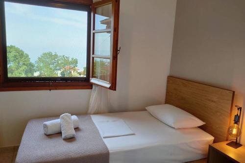 Ένα ή περισσότερα κρεβάτια σε δωμάτιο στο Olivia's Guest House