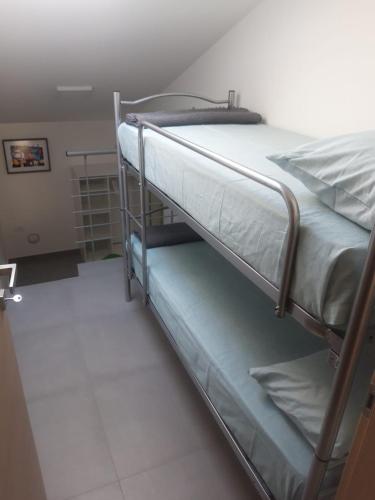 a bedroom with two bunk beds in a room at Dolce Brezza in Montesilvano