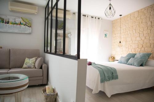 Katil atau katil-katil dalam bilik di Apartamentos Rincón de Cantarranas