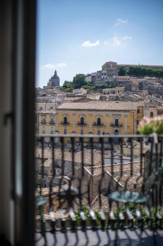 a view of a city from a balcony at Bed and Breakfast Terra del Sole Ibla in Ragusa