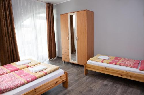 Posteľ alebo postele v izbe v ubytovaní Apartman Centrum