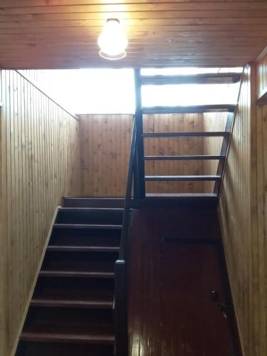 a set of stairs in a building with a light at Садиба "У стрийка" Сопіт in Sopot