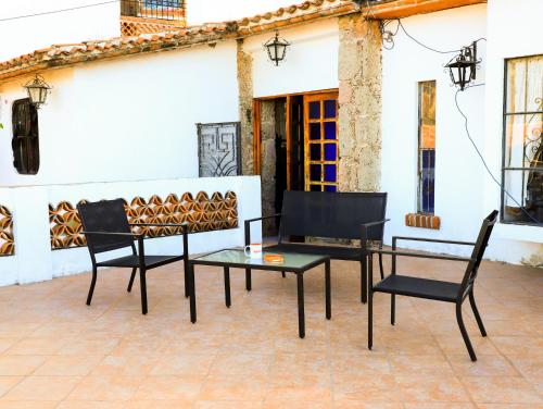 a group of chairs and tables on a patio at Casa de las Cruces Taxco in Taxco de Alarcón