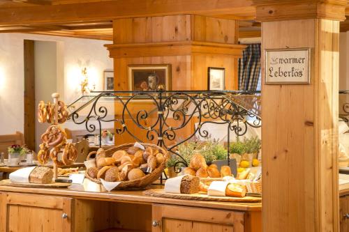 a display of bread and pastries on a counter at Hotel Obermaier in Munich