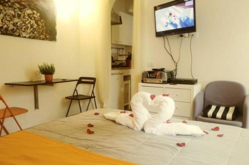 A bed or beds in a room at House of the Rising Sun