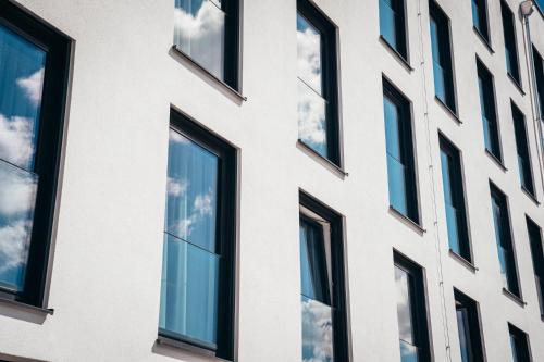a facade of a building with windows at kalm stay - munich east in Munich