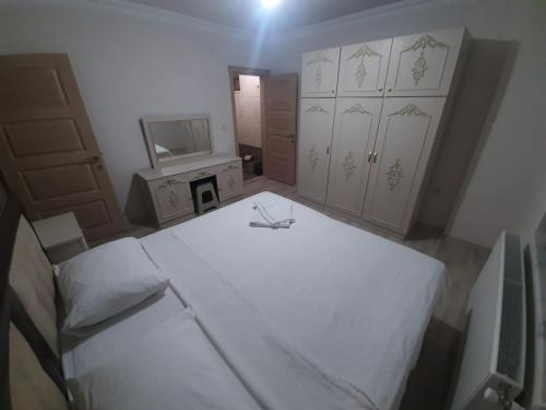 an overhead view of a bedroom with two beds and a television at Menekşe Apart 2 in Trabzon
