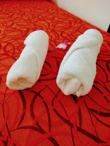 a peeled banana sitting on top of a bed at Ns Hotel in Termas de Río Hondo