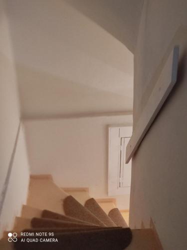 an empty stairs in a room with a white ceiling at Hacienda Bled Rooms in Bled