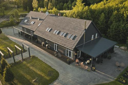 an aerial view of a large house with a roof at Guest House Garoza with Self Check-in in Tūja