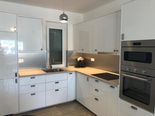 Kuchyň nebo kuchyňský kout v ubytování Glamour Apartman