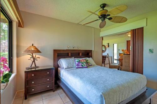 a bedroom with a bed and a ceiling fan at Sealodge F1 in Princeville