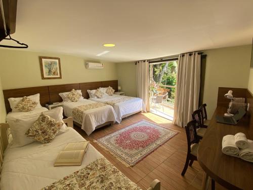 En eller flere senge i et værelse på Princesa Isabel Pousada e Hotel – Dom Pedro