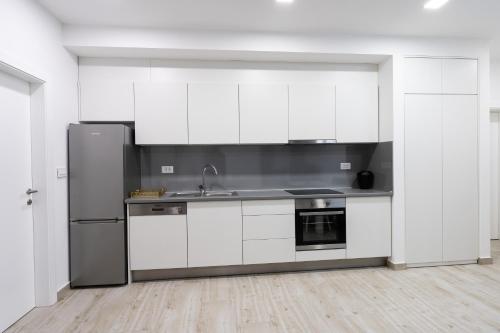 Η κουζίνα ή μικρή κουζίνα στο Apartmani Centar