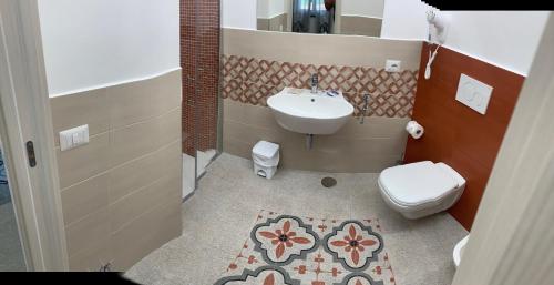 a bathroom with a sink and a toilet at Il covo degli Dei in Agerola