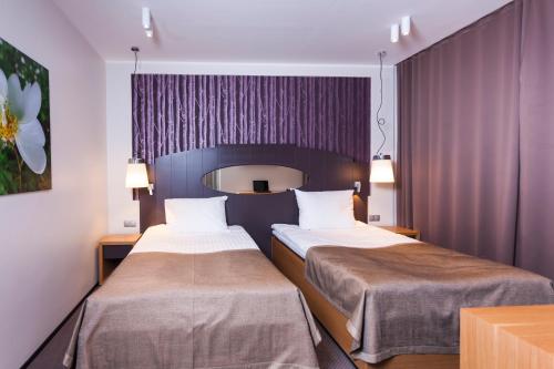 Ένα ή περισσότερα κρεβάτια σε δωμάτιο στο Paide SPA Hotell