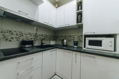 Kuchyň nebo kuchyňský kout v ubytování Urban Lux Apartmani