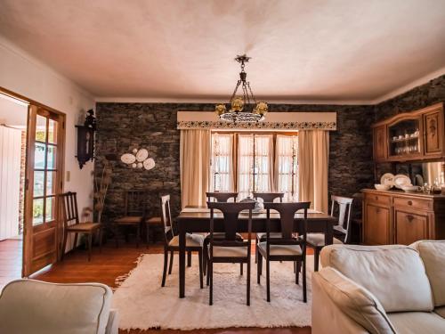 a dining room with a table and chairs at Quinta da Vela in Meirinhos