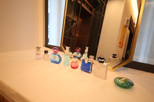 a counter top with a group of glass figurines on it at Hotel Vantt in Gwangju