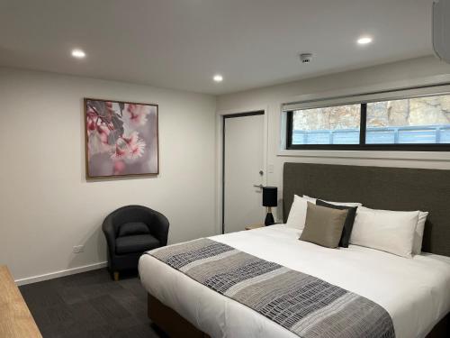 Ένα ή περισσότερα κρεβάτια σε δωμάτιο στο Risdon Brook Hotel