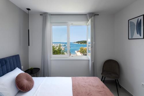 Posteľ alebo postele v izbe v ubytovaní Ampelea apartment