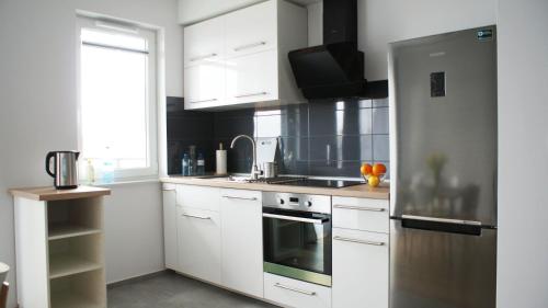 Kuchyňa alebo kuchynka v ubytovaní Apartament Imagus Oliwa