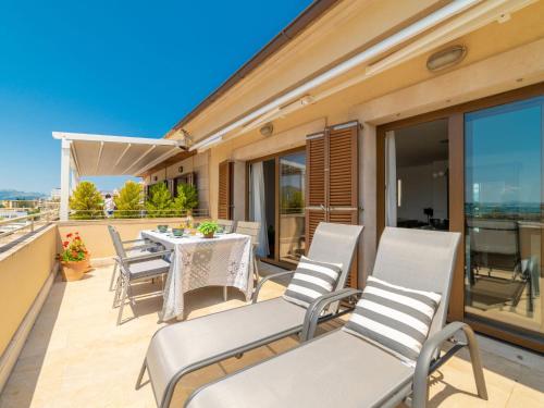 a patio with a table and chairs on a balcony at Apartment Nautic Sea Views by Interhome in Port d'Alcudia
