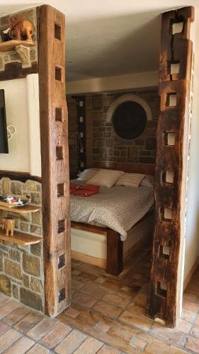 a bedroom with a bunk bed in a brick wall at Studio-apartments Monfort in Portorož