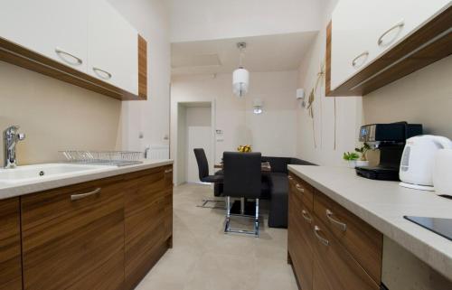 a kitchen with a sink and a counter top at NN Apartman Budapest in Budapest