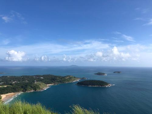 an aerial view of an island in the ocean at Baan Saint-Tropez Seaview Villas Kata Beach in Kata Beach
