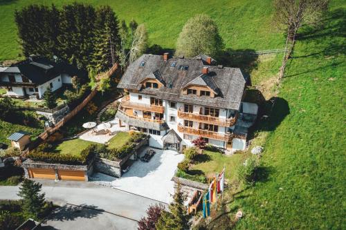 an aerial view of a large house in a field at Nordic Lodge in Bad Kleinkirchheim
