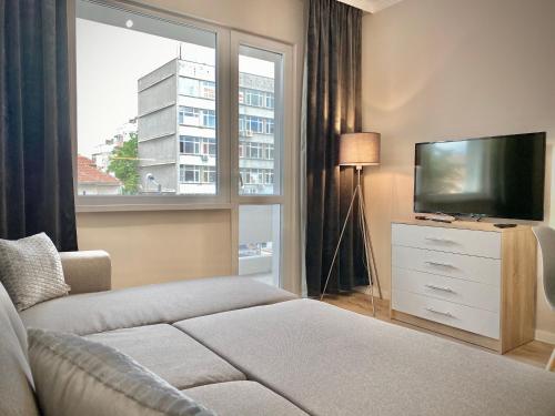 Säng eller sängar i ett rum på Stylish Top Centre Apartment for 4 guests