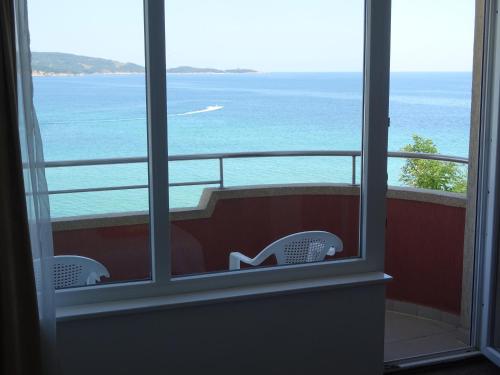 a view of the ocean from a room with a window at Dobrevi Guest House in Primorsko