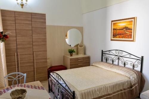 A bed or beds in a room at La Torretta Dei Sogni