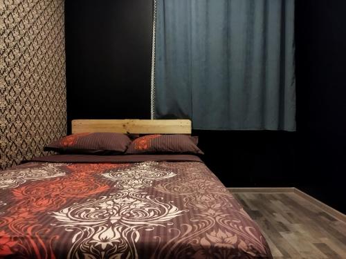 Una cama o camas en una habitación de Shapatava ApartHotel