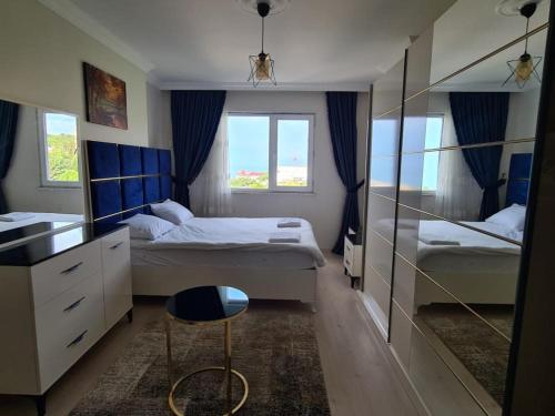 Postel nebo postele na pokoji v ubytování kayan apart