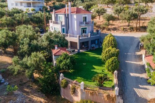 an aerial view of a house with a yard at Akrivi's House in Kalamata in Kalamata