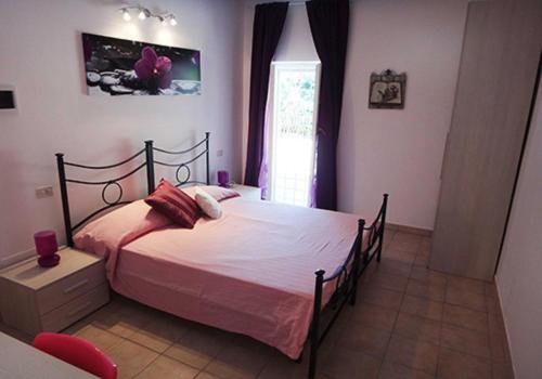 Tempat tidur dalam kamar di Affittacamere Villa Drusilla