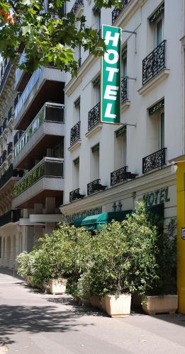 a building with a hotel sign in front of it at Hôtel Transcontinental in Paris