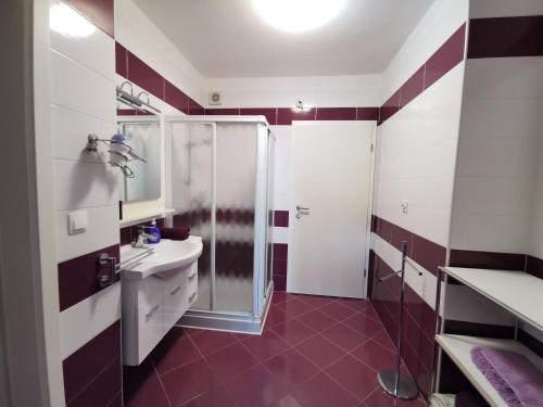 a bathroom with a shower and a sink at More in Malinska