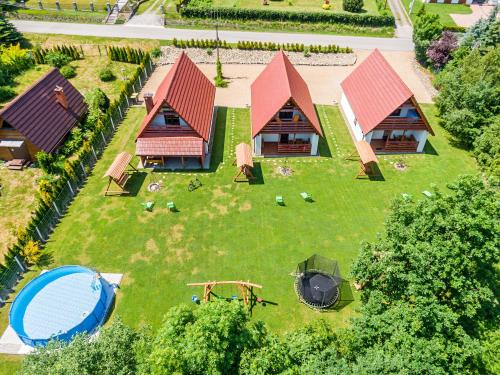 an aerial view of a house with a yard at Domki Pod Czarnym Groniem in Rzyki