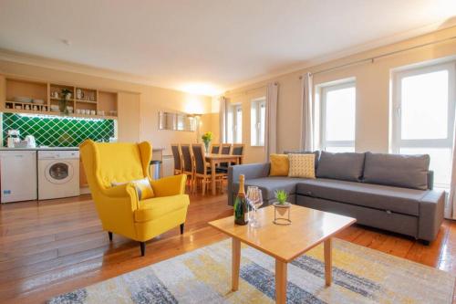 a living room with a couch and a table at 310 - The Carrowbeg at The Harbour Mills by Shortstays in Westport