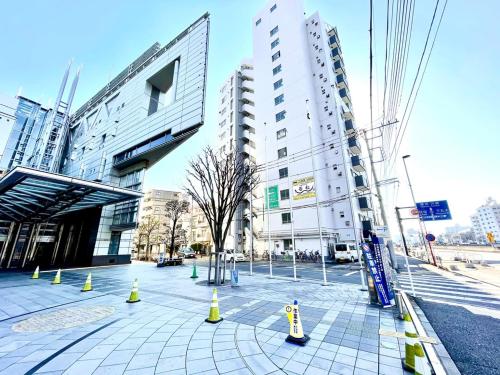 a street in a city with tall buildings at QuintessaHotel TokyoHaneda Comic&Books in Tokyo