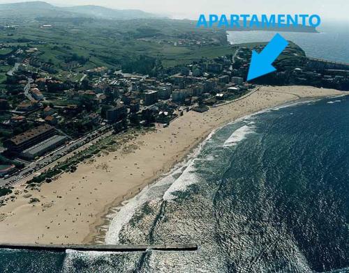 an aerial view of a beach with a blue arrow at A pie de playa en Suances in Suances