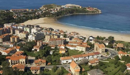 an aerial view of a city and a beach at A pie de playa en Suances in Suances