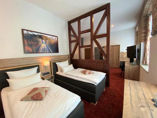 Voodi või voodid majutusasutuse Hotel Friedchen mit eigener Fleischerei toas